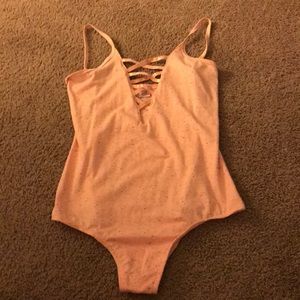 Pink body suit